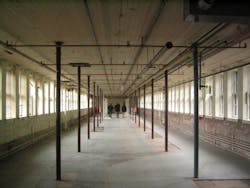 Before and after photos of the Waltham Watch Factory conversion to residential. The width of the floor plates are 32 feet. Image Bruner / Cott