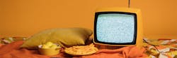 Tv With Blank Scree And Food On Bed